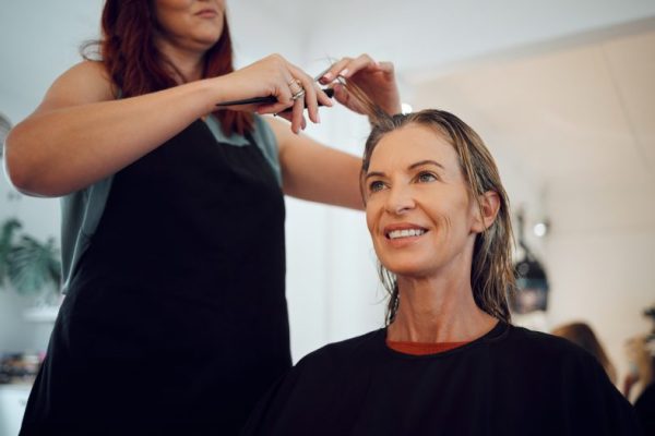 Beauty salon, hairdresser and hair cut for woman customer, cosmetics change and fashion in boutique