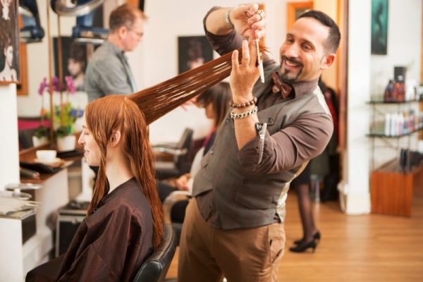 Stylist carefully snipping away for the perfect haircut.