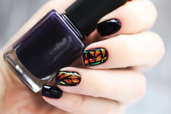 Trendy female manicure with nail art.
