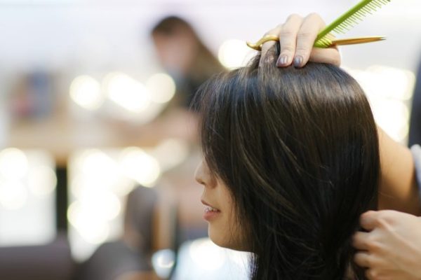 Woman with hair cut at salon